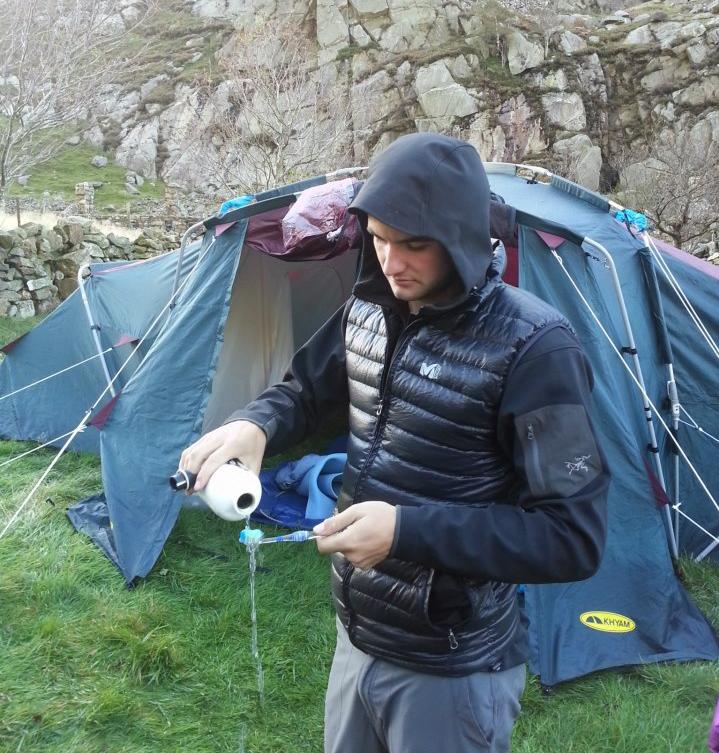 Tent in hut garden with ICMCs resident male model performing traditional club trip activities